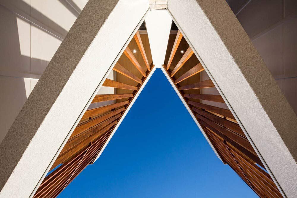Looking Up at a Building With a Blue Sky in the Background — DeBu Studios In Russell Vale, NSW