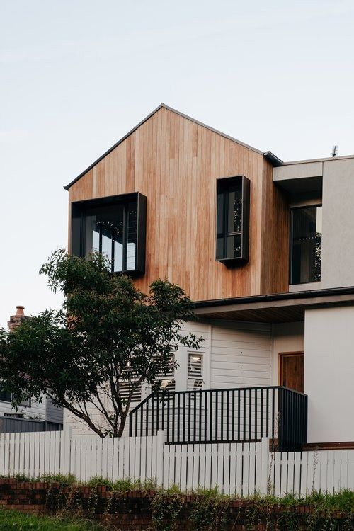 A House With a Wooden Roof and a White Picket Fence — DeBu Studios In Russell Vale, NSW
