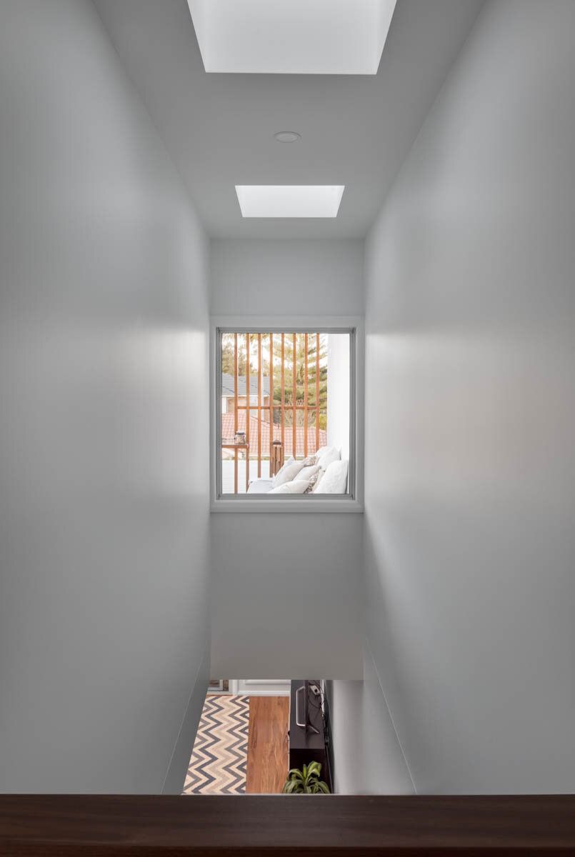 A View of a Living Room From the Top of a Staircase — DeBu Studios In Russell Vale, NSW