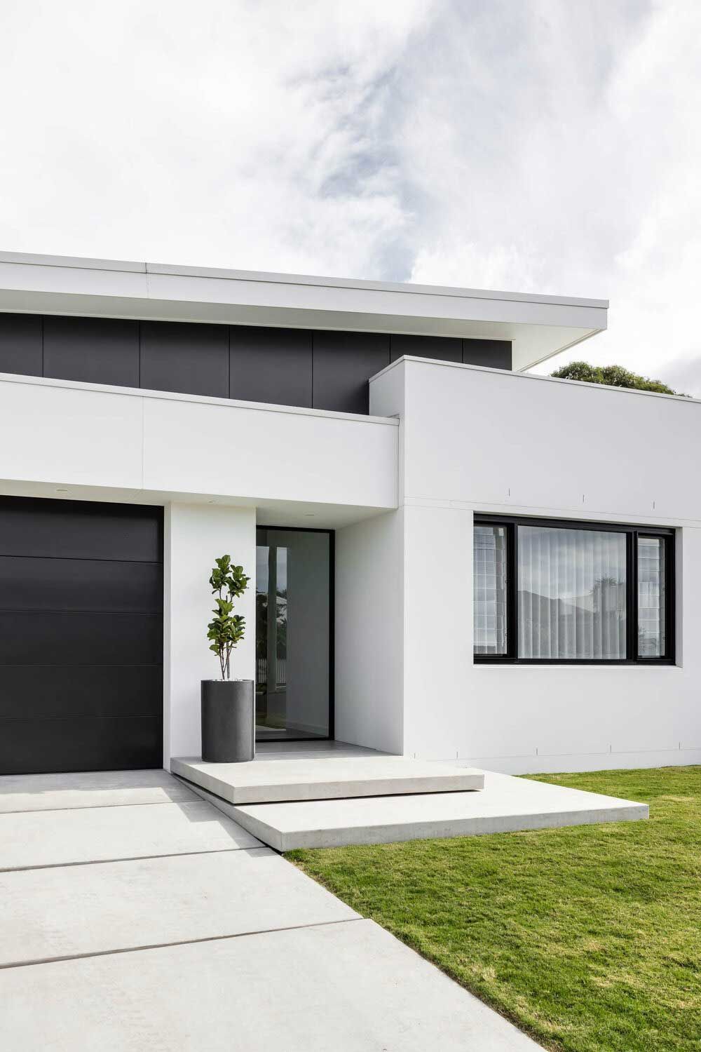 A Modern White House With a Black Garage Door — DeBu Studios In Russell Vale, NSW