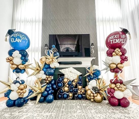 Blue and gold balloon display for a graduation with “Blue ELAN” and “Next Up Temple” signs