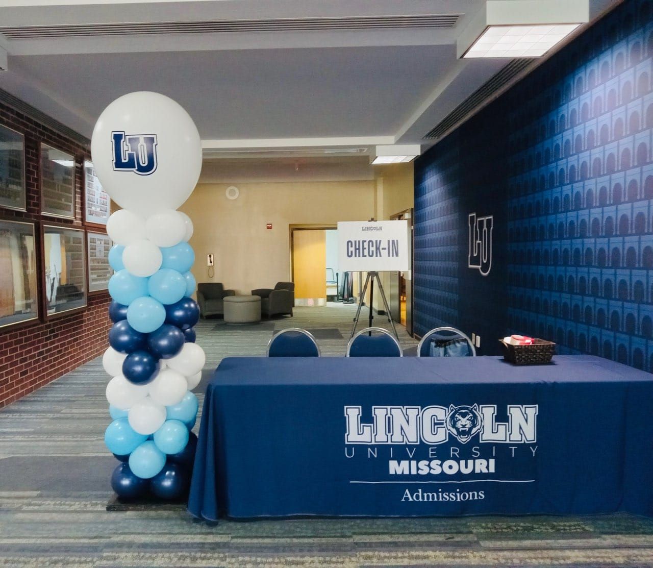 Lincoln University-Missouri admissions table with blue balloon column and welcome sign in a hallway