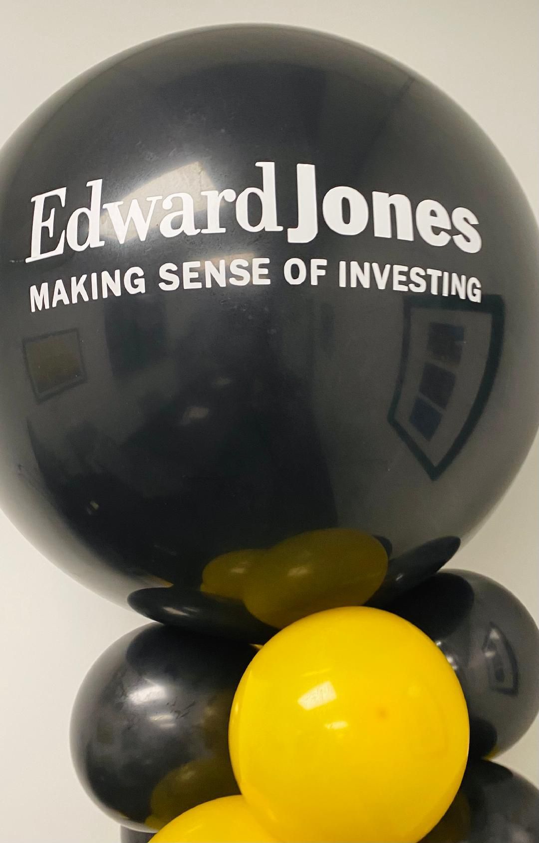 Black and yellow balloons with an Edward Jones logo and “Making Sense of Investing” text
