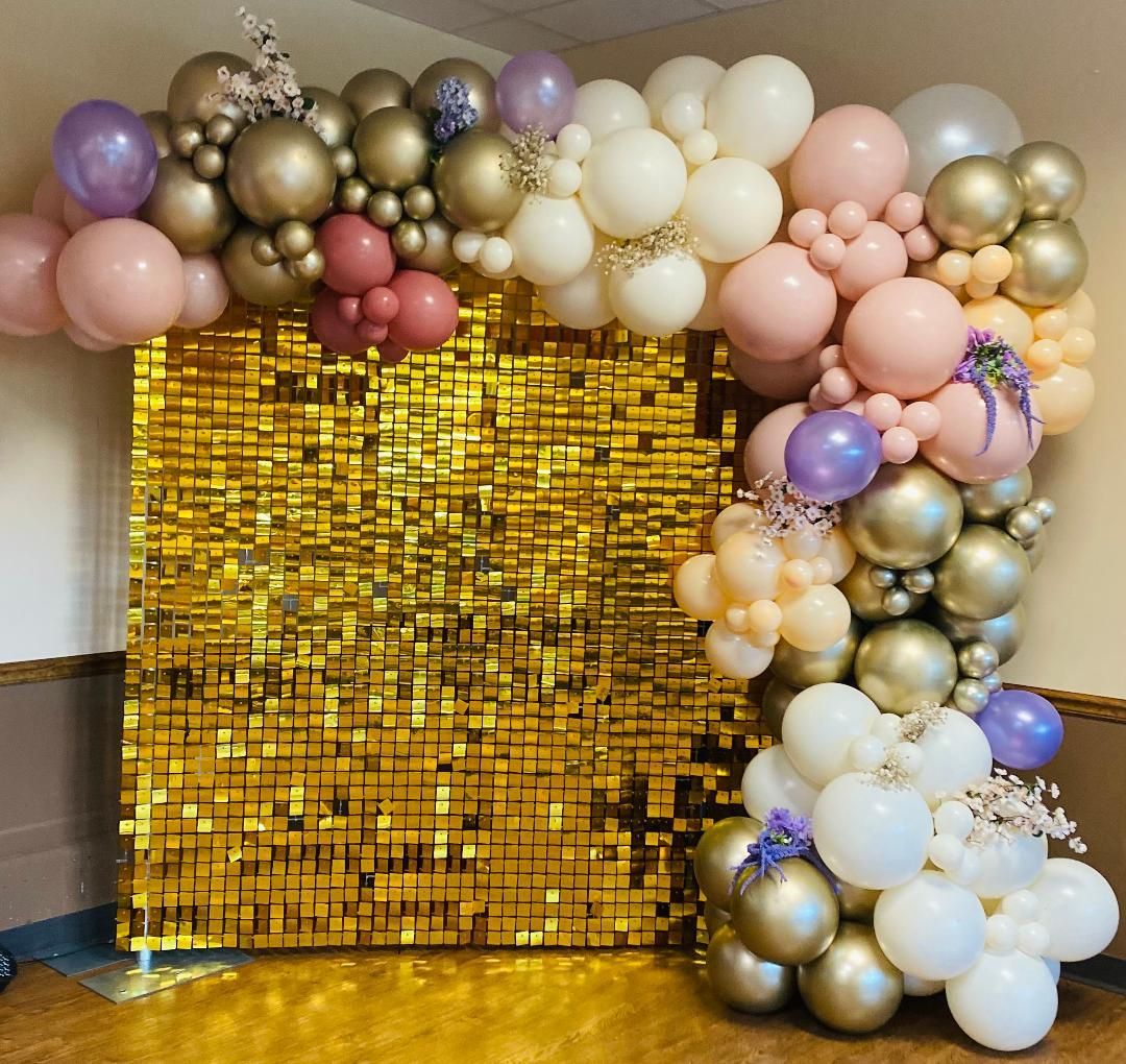 Gold sequin backdrop with pastel and metallic balloon arch and cluster decoration