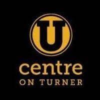 Centre on Turner logo with gold “U” on a black background