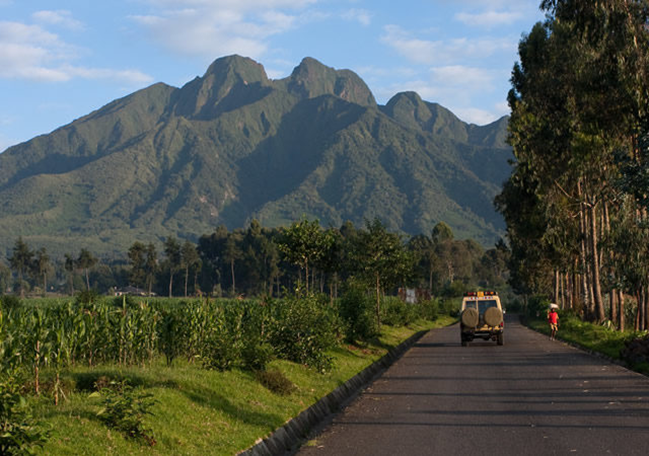 road to volcanoes national park with view of mt. sabyinyo