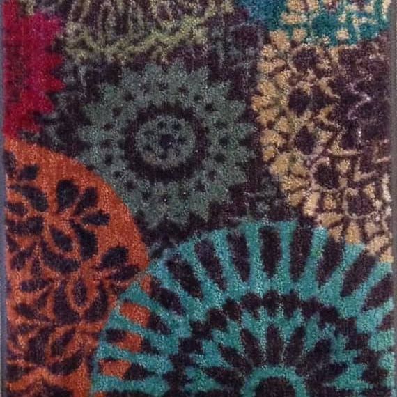 Colorful patterned fabric with teal, purple, orange, and beige circular designs