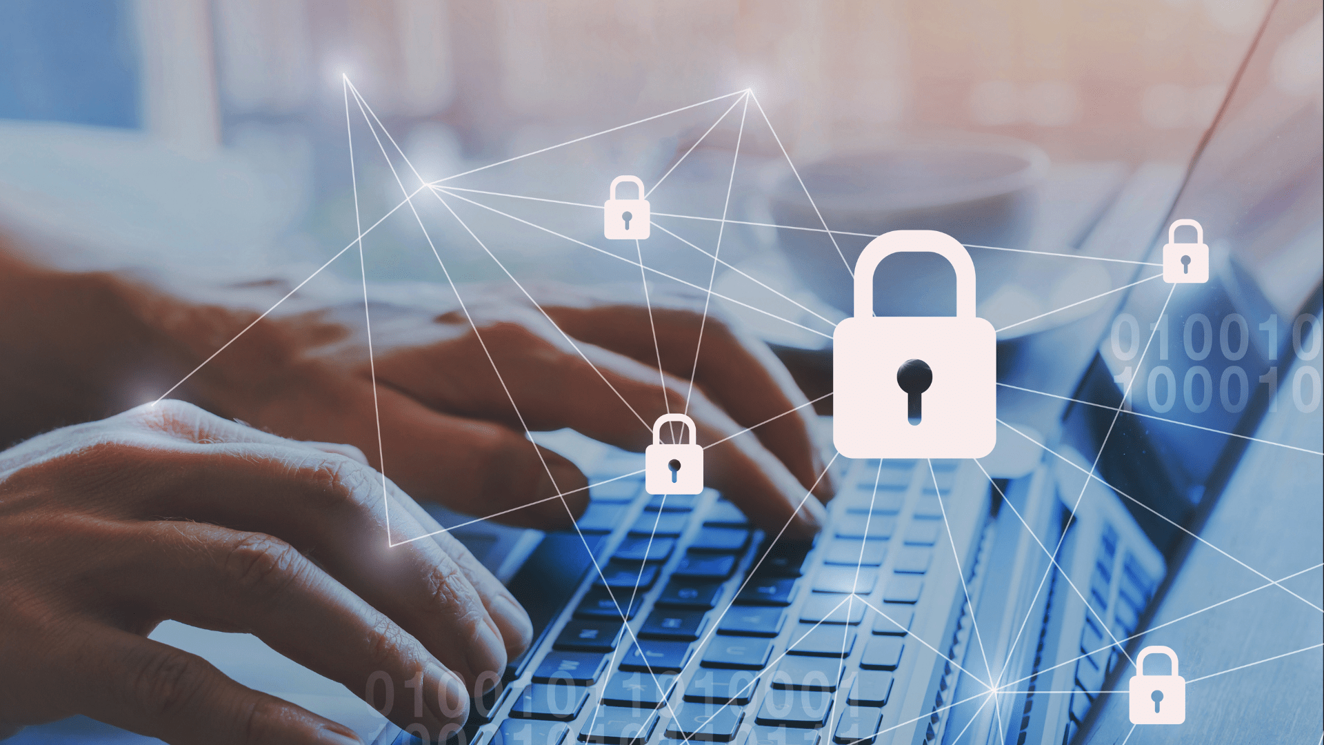 Hands typing on a laptop with digital security locks overlaid, representing cybersecurity.