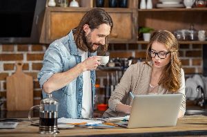 Man And Woman Checking Files On Laptop — Clarksville, AR — Phil Taylor Insurance Agency, Inc. Man And Woman Checking Files On Laptop — Clarksville, AR — Phil Taylor Insurance Agency, Inc.