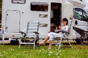 Women Sitting Outside Of The Rv Car — Clarksville, AR — Phil Taylor Insurance Agency, Inc. Women Sitting Outside Of The Rv Car — Clarksville, AR — Phil Taylor Insurance Agency, Inc.