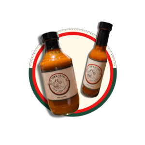 Two amber bottles with black caps on a red, green, and white circular logo background