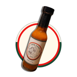Bottle of hot sauce with a black cap, centered on a red and green circular background