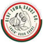Old Town Sauces Co. logo with garlic, a lemon slice, and the slogan “Lovin’ Good Sauce.”