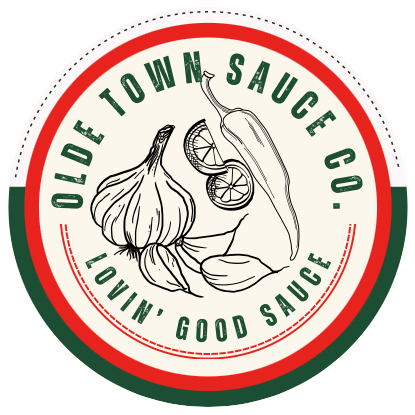 Old Town Sauces Co. logo with garlic, a lemon slice, and the slogan “Lovin’ Good Sauce.”