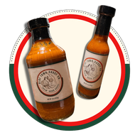 Two amber sauce bottles with black caps on a red and green circular background.