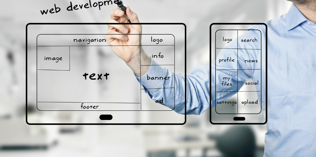 A man is drawing a web development diagram on a whiteboard