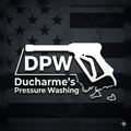 DPW Ducharme’s Pressure Washing logo with white pressure washer over a dark American flag background