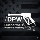 DPW Ducharme&rsquo;s Pressure Washing logo with white pressure washer over a dark American flag background