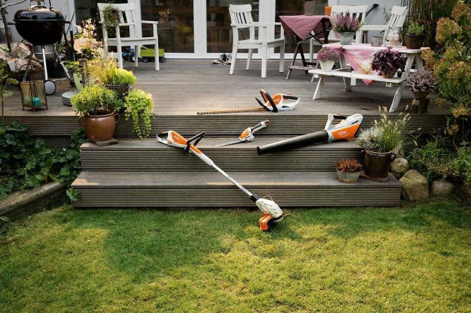A Lawn Mower Is Sitting On Top Of A Wooden Deck — Ken Matthews Auto & Mower Centre In Ulladulla, NSW