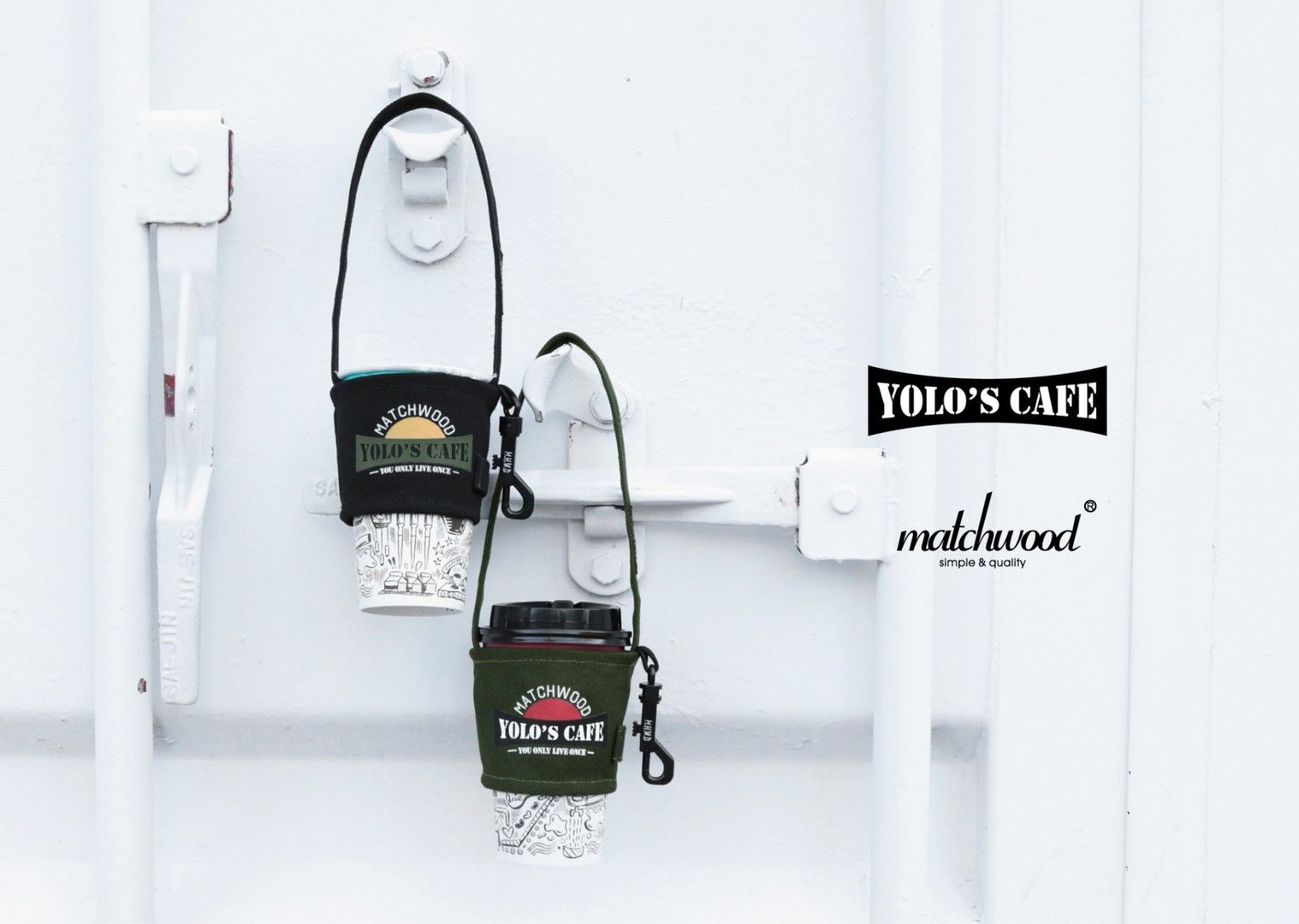Two cup holders are hanging on a white wall.