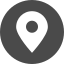 A white pin in a black circle on a white background.