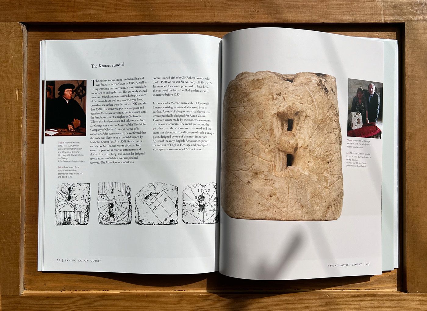 Acton Court Guidebook open to a page with a picture of sundial