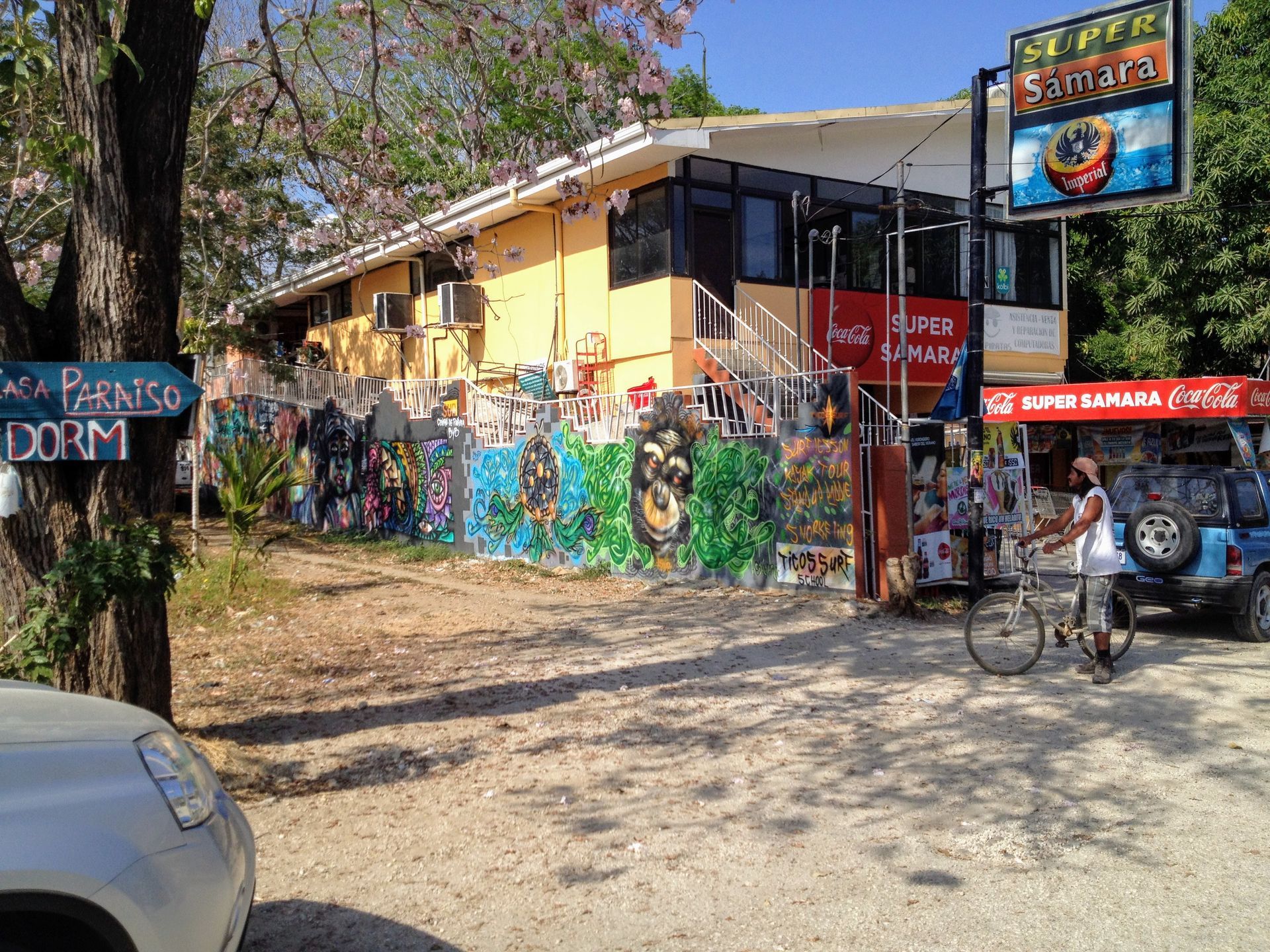 Yellow building with graffiti art, sign for 