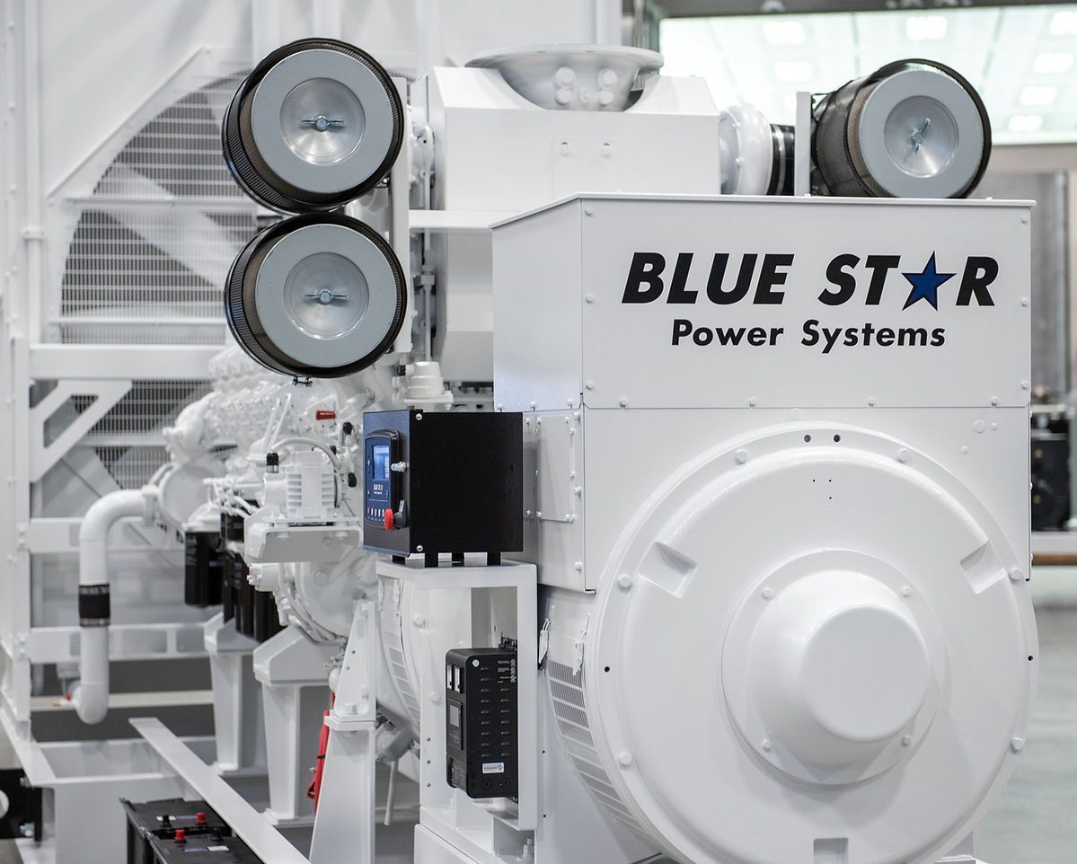 Blue Star Power Systems industrial engine with large front casing and two circular components, white machinery