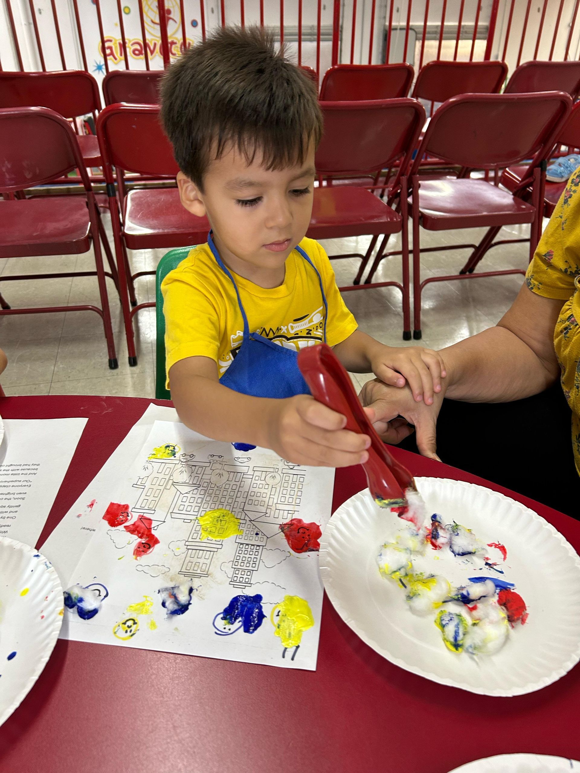 Young child creating an art project during a Morning of Discovery class at Gravity Gymnastics