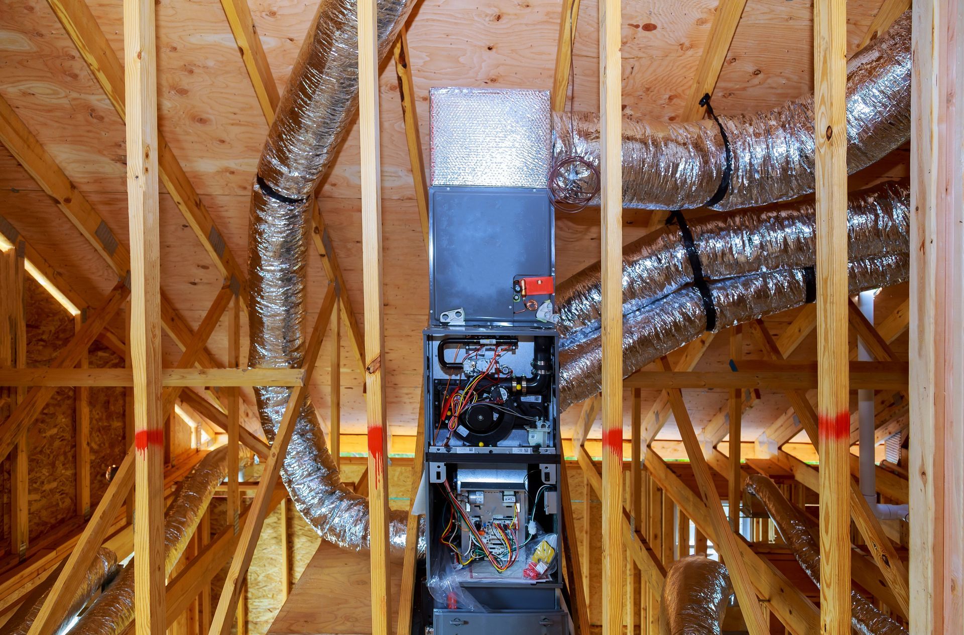 M.N.S. Ltd. technician installing a high-efficiency furnace in Saskatoon home — professional HVAC in