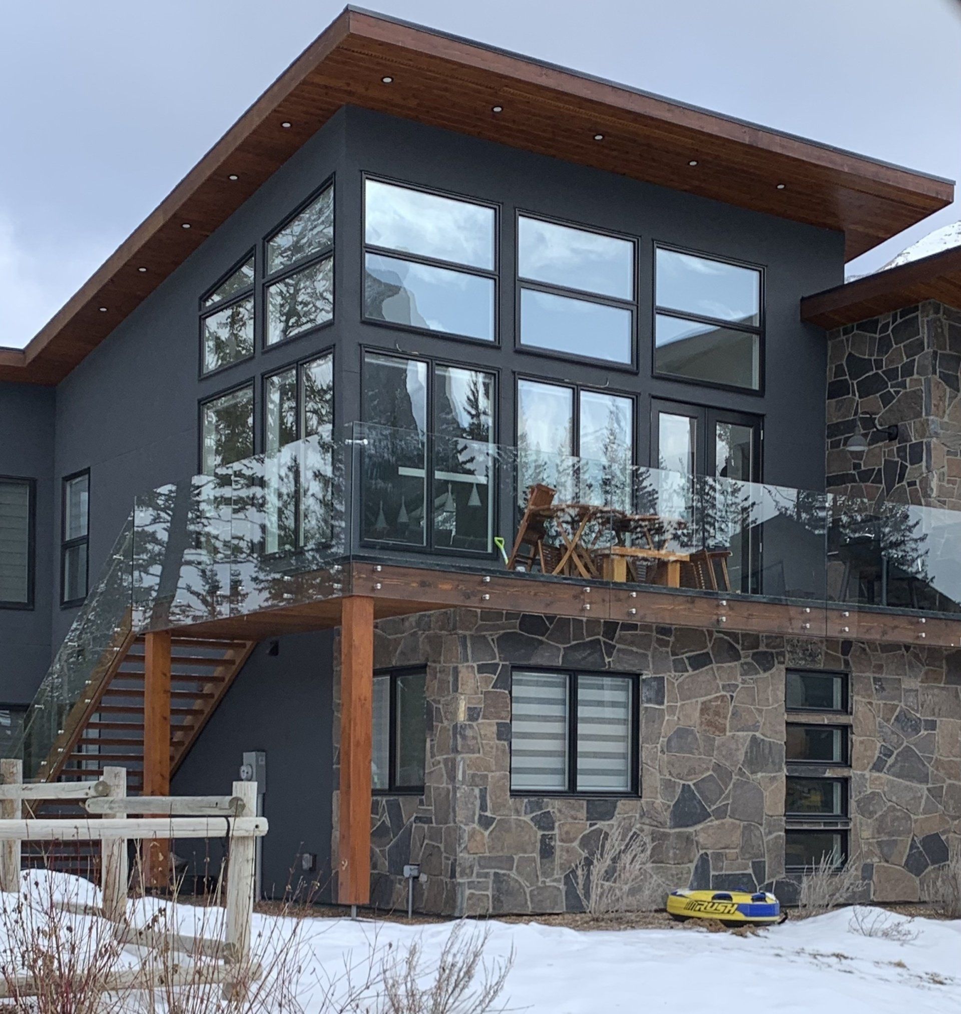A large house with a lot of windows and stairs