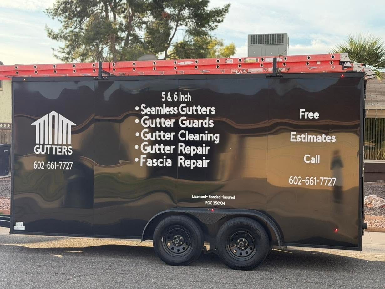 Brown gutter-cleaning trailer with black trim and company services listed on the side