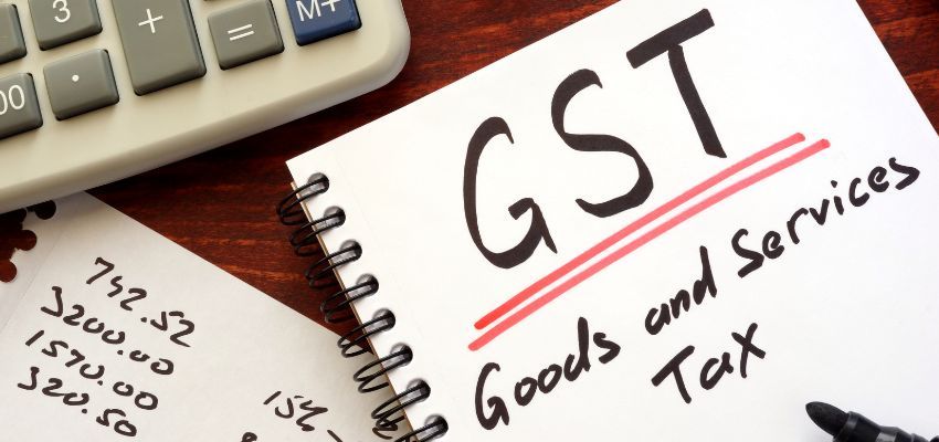 Someone calculates his GST credit.