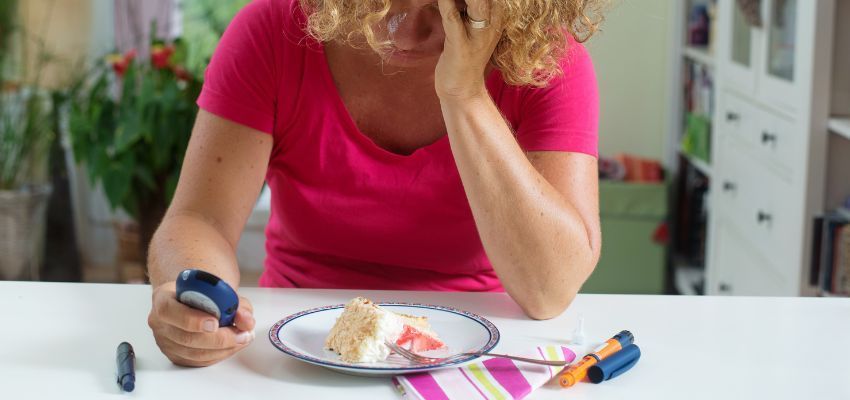 A diabetic woman checks her sugar level.