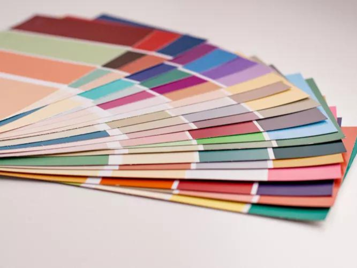 A bunch of different colored papers stacked on top of each other