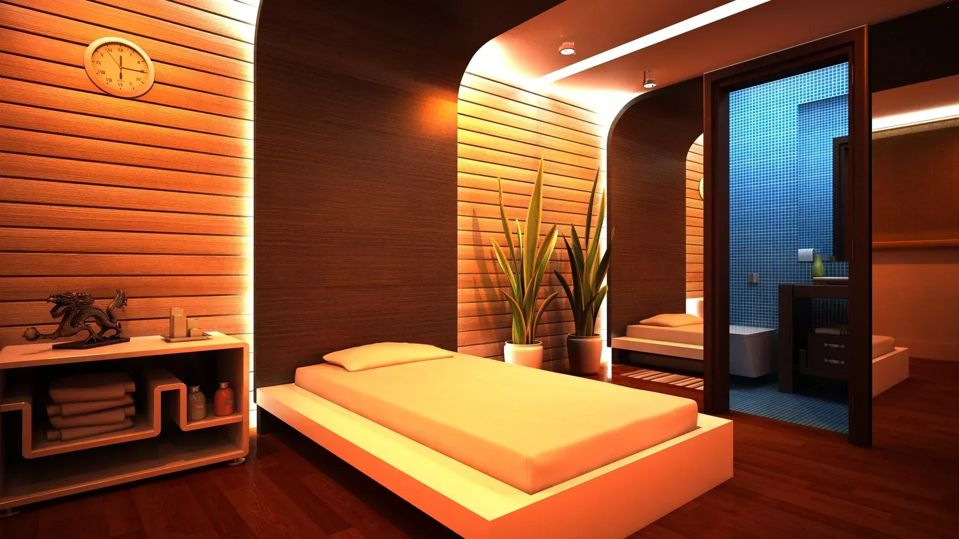 Uma sala de spa com uma maca de massagem, painéis de madeira nas paredes, iluminação aconchegante, plantas e um banheiro.