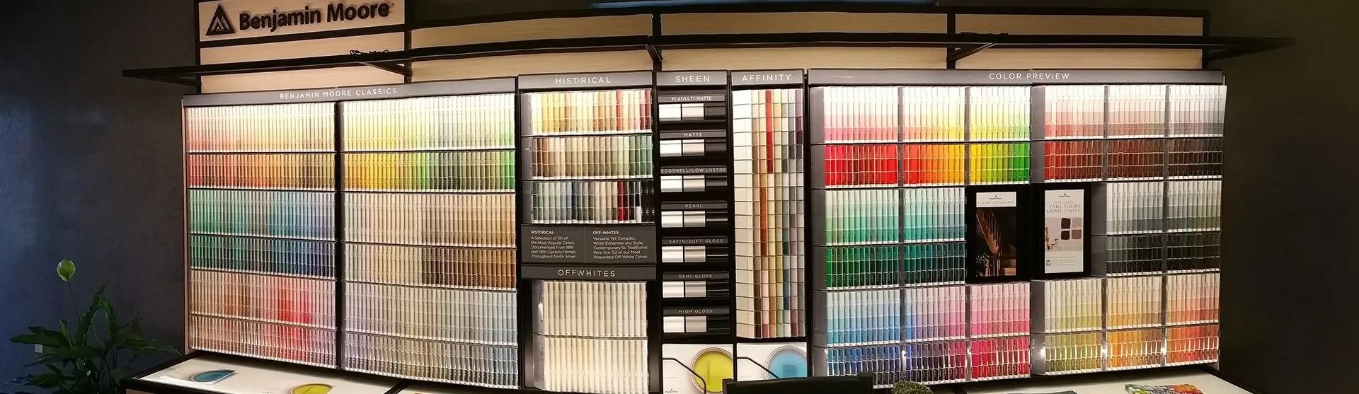 Colorful storefront display of books and posters under warm lights at night