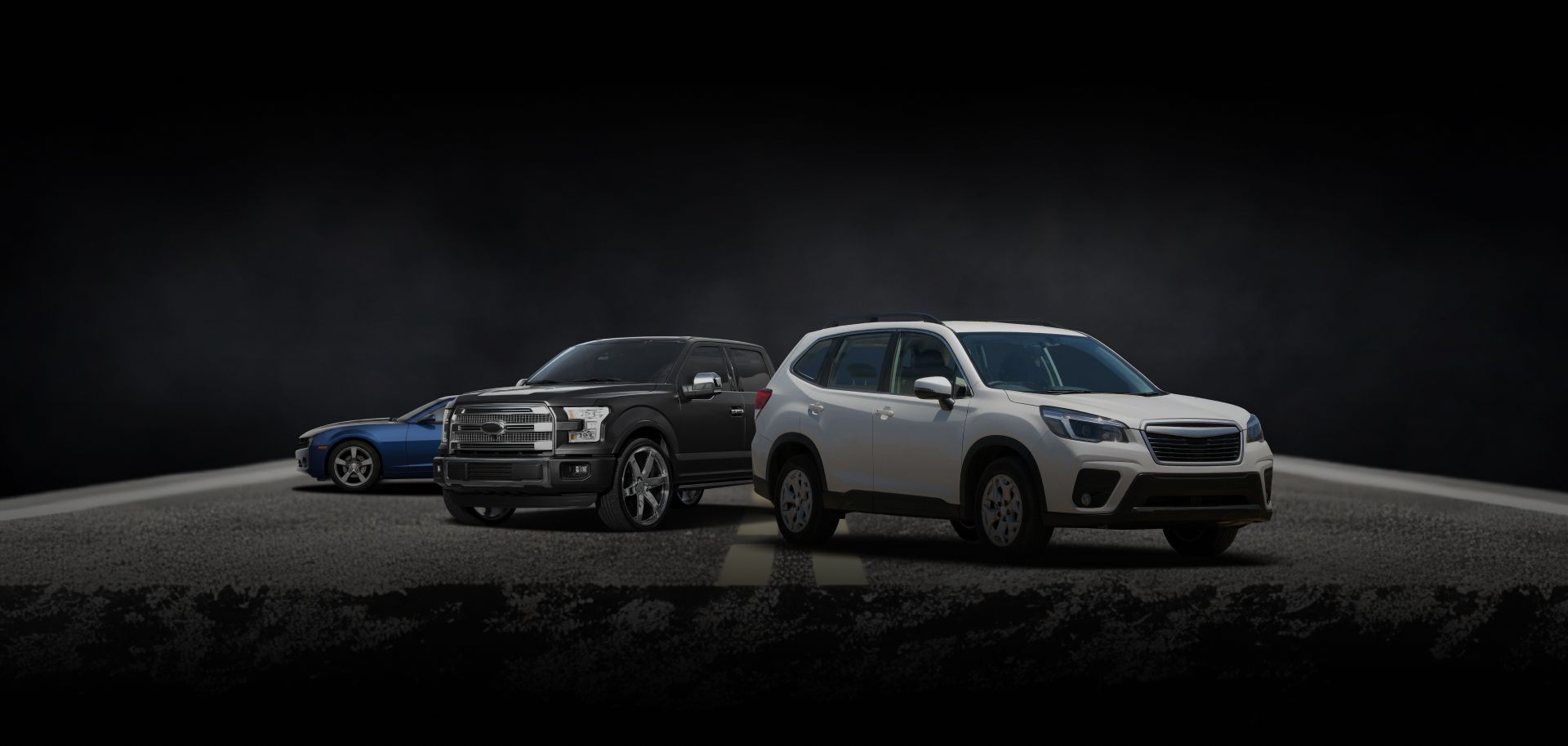 Three cars on a dark stage, with a white SUV in front and a blue car and gray truck behind it | Rick's Auto Shop
