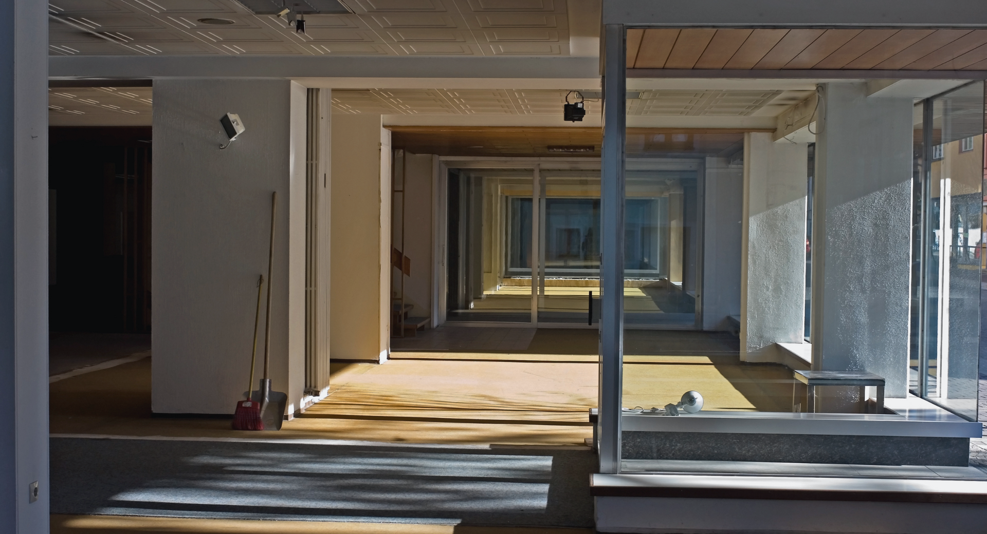 An empty building with a lot of windows and doors