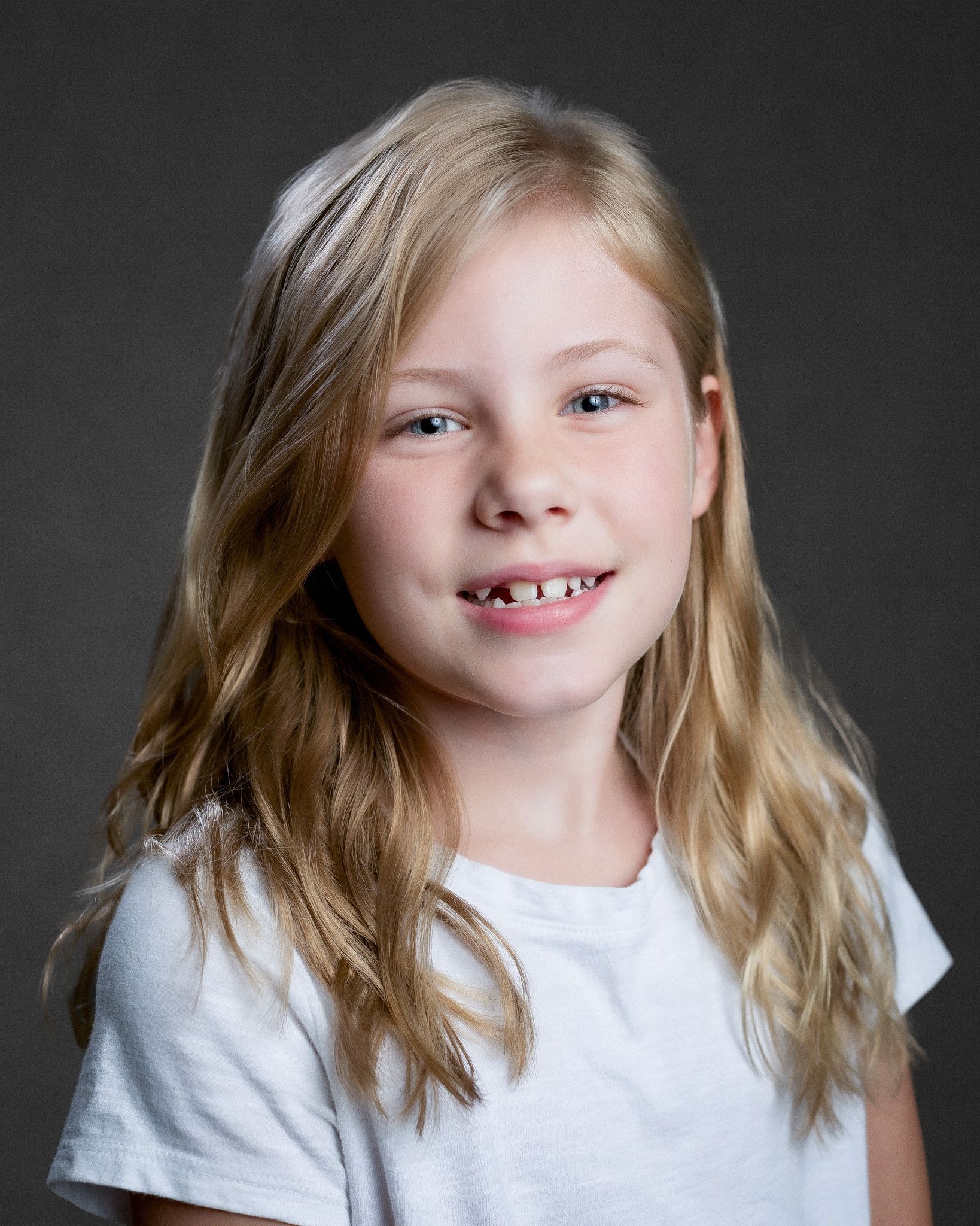 Professional homeschool student headshots taken on location for co-ops in Middle Tennessee. Clean, natural lighting portraits with a simple studio-style look.
