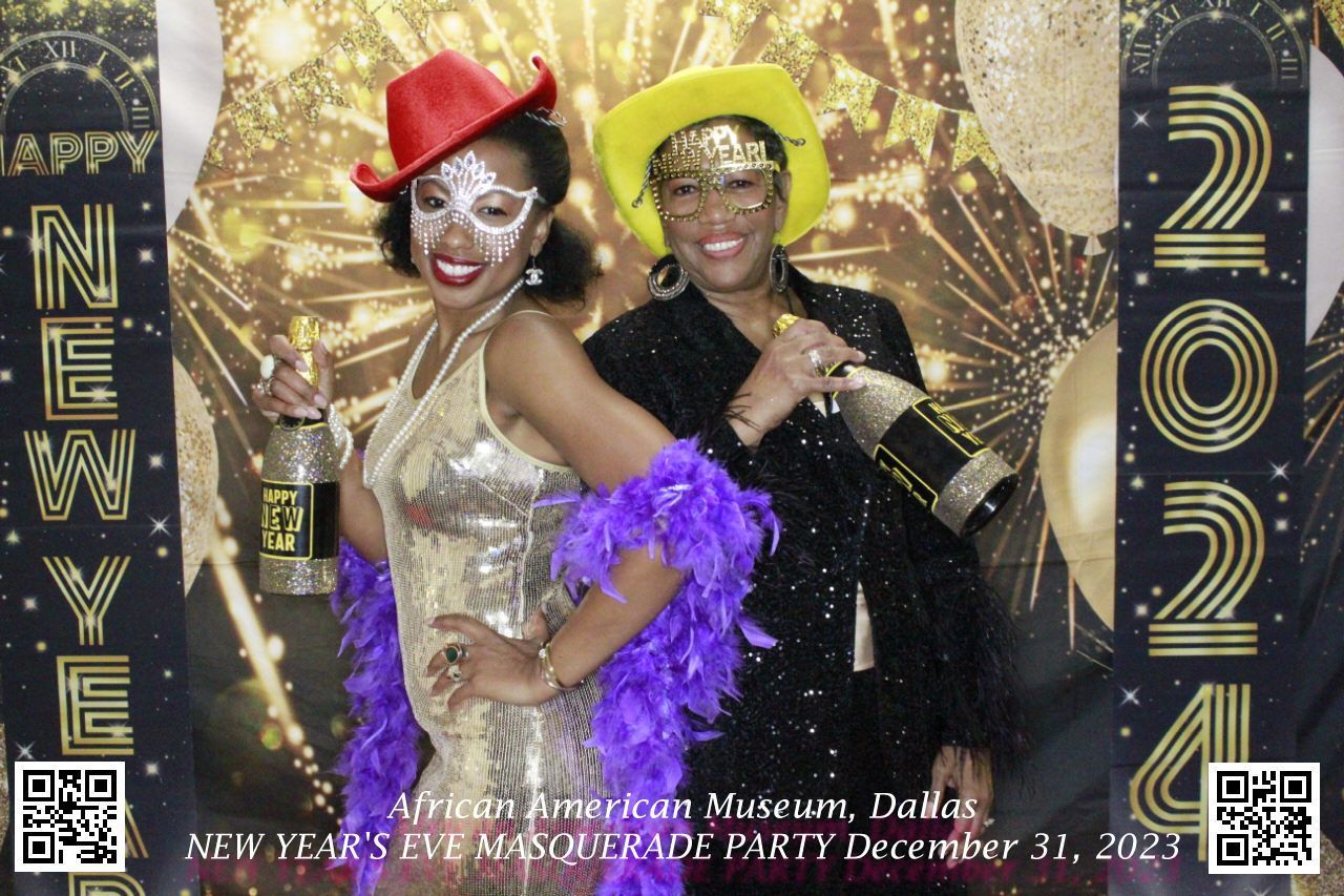 Two women are posing for a picture at a new year 's eve masquerade party