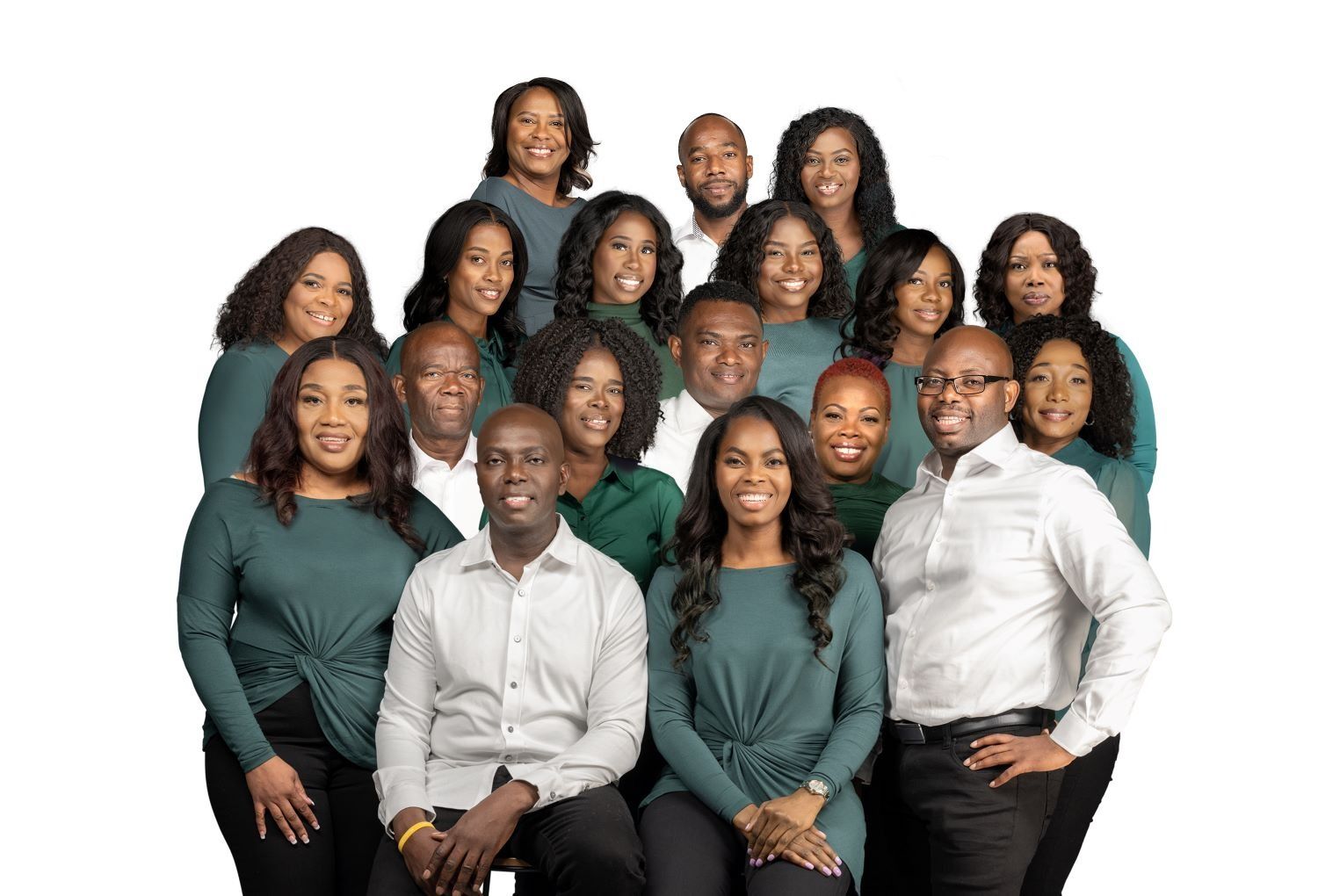 Group portrait of eleven people posing against a white background, wearing coordinated teal and white clothing.