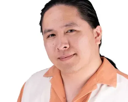Portrait of a person with black hair, wearing a white shirt with an orange collar, against a white background