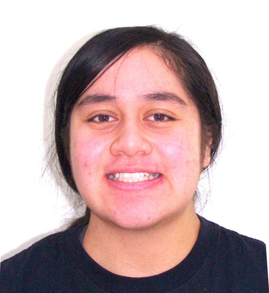 A woman with a black shirt on smiles for the camera