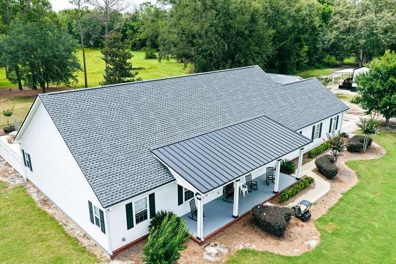 Aerial view of a well-maintained Florida home with a newly installed asphalt shingle roof.
