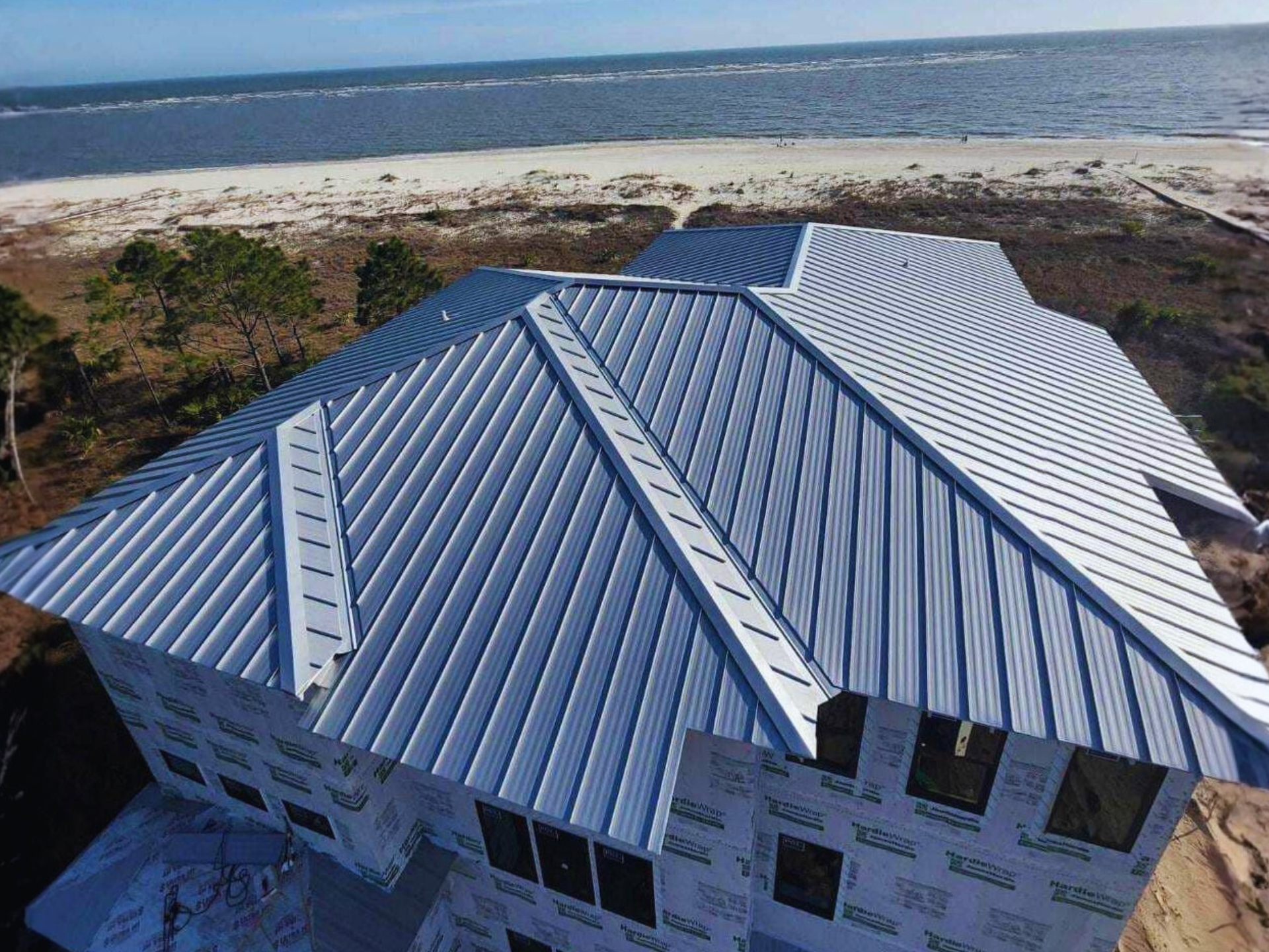 Close-up of a standing seam metal roof installation in Florida, showcasing its reflective surface