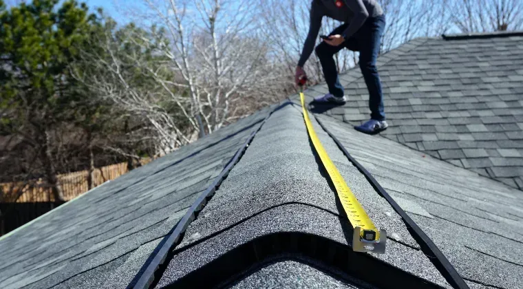 Service provider doing roof inspection in Gainesville home.