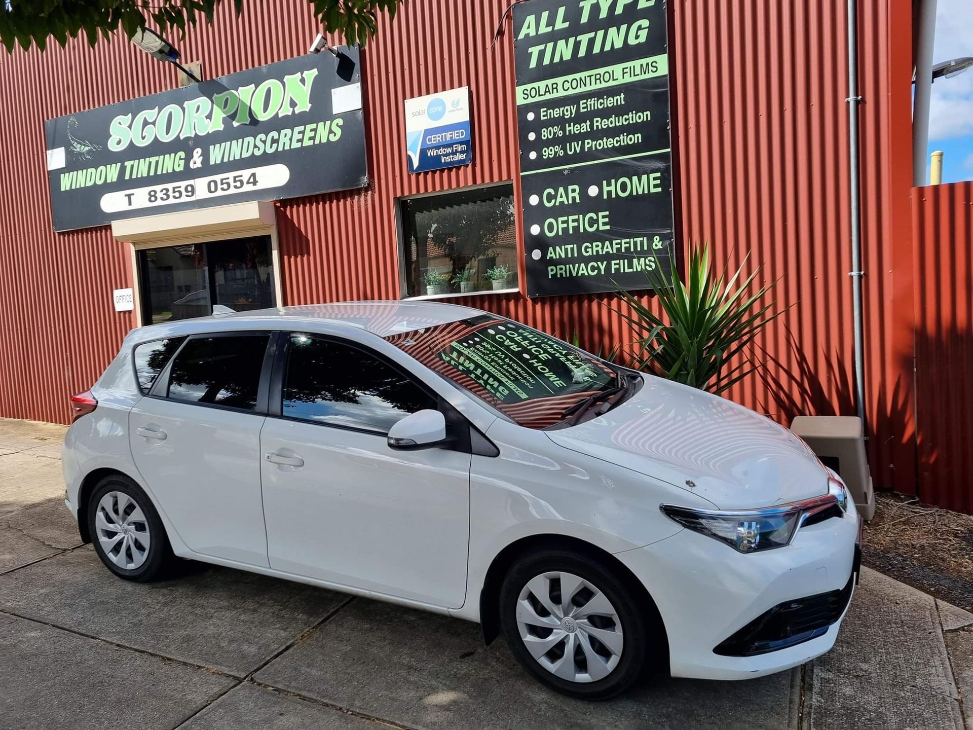 White Car in Front of Business Building — Enfield, SA — Scorpion Window Tinting
