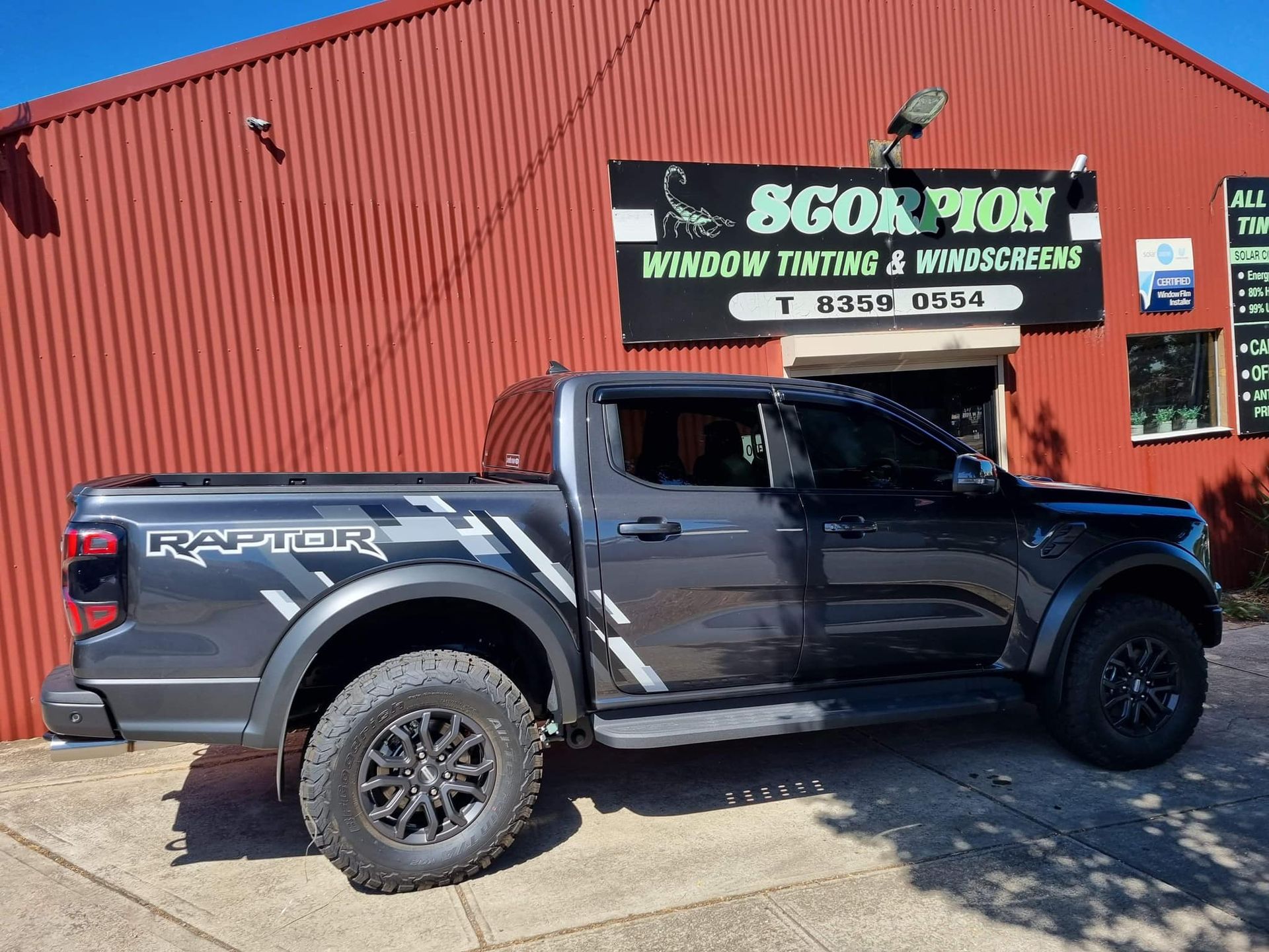 Black Ute in Front of Business Building — Enfield, SA — Scorpion Window Tinting