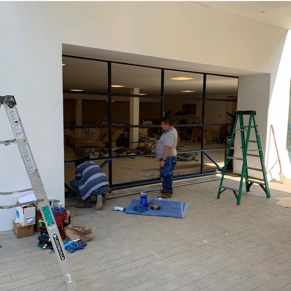 Two Men Working on Custom Garage Door — Los Angeles, CA — A & S Glass